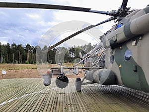 Side view of a military helicopter.