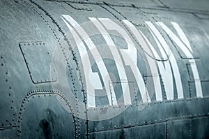 Side view of military plane with inscription. photo