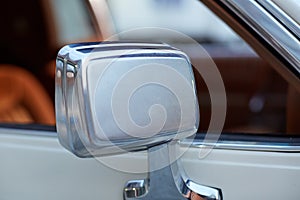 Side view mirror on a classic white car