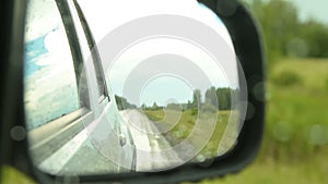 Side-view mirror of driving car