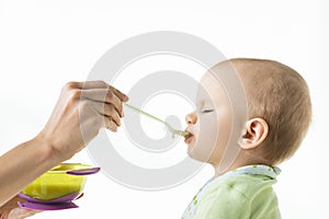 Side view of mother feeding baby