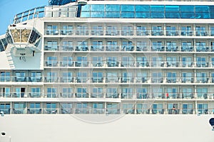 Side view of multi-deck cruise ship with cabin windows