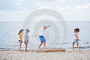 side view of multicultural children playing photo