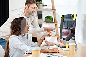 side view of multiethnic business people discussing new marketing strategy at workplace