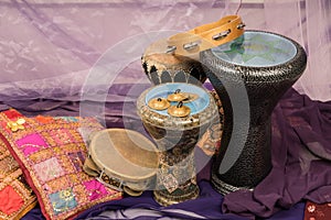 Side view of musical instruments of a bellydance percussiongroup with darbuka`s, tambourines and zills