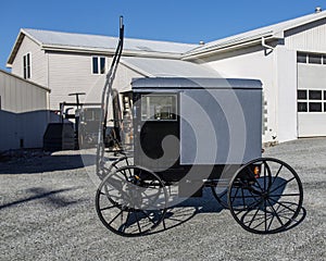 Side View of a New Amish Buggy, Parked With Out a Horse, Waiting to be Sold on a Sunny Day