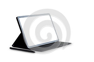 Side view of the new model 10.4` black tablet is placed on the cover with a pen, blank screen with copy space for text