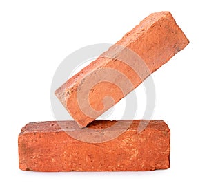 Side view of old red or orange bricks in stack isolated on white background with clipping path