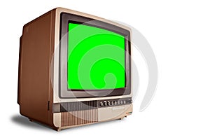 Side view of old retro home TV receiver with blank green screen isolated on white background with clipping path
