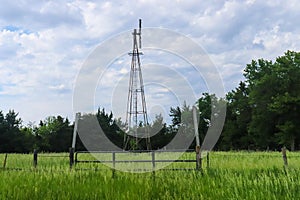Side View of an Old Rustic Windmill on Nebraska pasture landscape