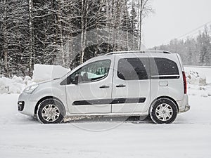 Side view of an Opel Combo Life passenger van on a winter day.