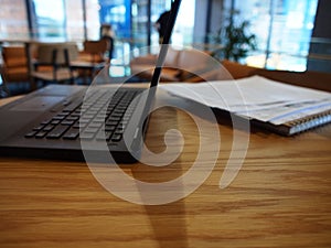 A side view of an open laptop on a table