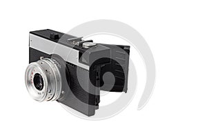 Side view of an opened old vintage photo camera using film strip, isolated on white background