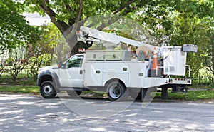 Side view of parked communication utility truck