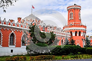 Side view of the Petroff Palace through the fortress wall with a tower, Moscow, Russia.