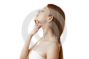 Side view photo of young woman massaging her neck and chin to prevent double chin against white studio background.