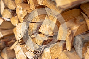 Side view of a pile of firewood, selective focus.