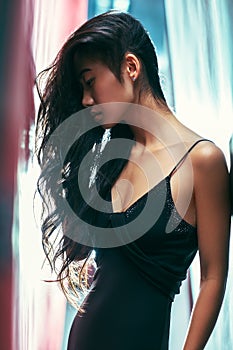 Side view portrait of asian beautiful woman posing, head tilted, look down