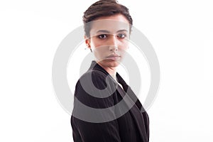 Side view portrait of beautiful young girl wearing a black jacket over white background