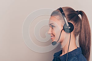 Side view portrait of cheerful girl in headphones with microphone