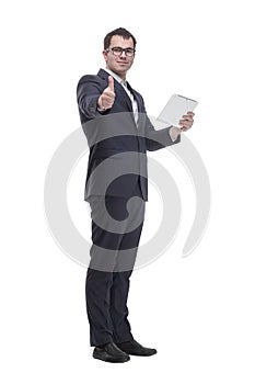 Side view portrait of curious and smiling businessman with tablet looking and pointing to side