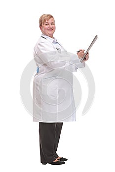 Side view portrait of experienced female physician writing patients report