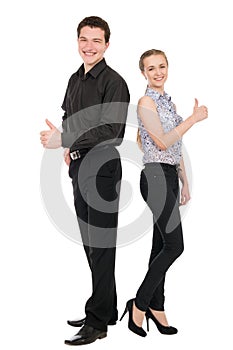Side view portrait of happy couple showing thumbs up sign while
