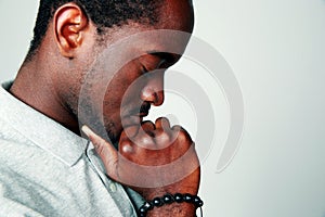 Side view portrait of a pensive african man