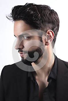 Side view portrait of stylish young man wth a modern hairstyle