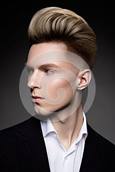 Side view portrait of thinking stylish young man