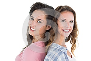 Side view portrait of two happy young female friends