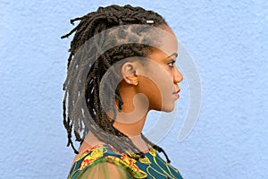 Side view portrait of a woman with dreadlocks