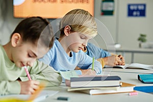 Boy Writing in School