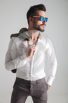 Side view portrait of a young fashion man wearing sunglasses