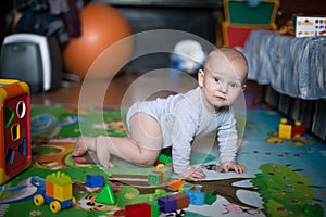 Side view of pretty crawling baby