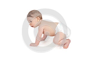 Side view of pretty crawling baby