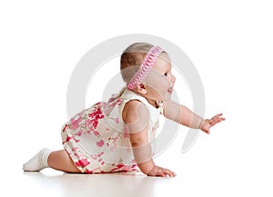 Side view of pretty crawling baby girl