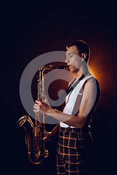 side view of professional stylish young jazzman
