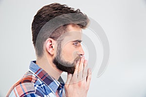 Side view protrait of a casual man praying