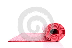 Side view of red open yoga mat for exercise, isolated on white background.