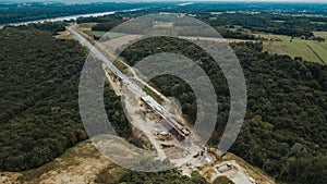 Side view of a road under construction in Brcko district surrounded by fields