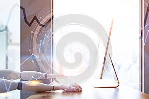 Side view of robot using computer, graph
