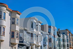 Side-view of rowhouses with bay windows against the sky in San Francisco, California