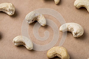 side view of salted roasted pistachios isolated on old paper texture background