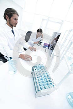Side view of scientists working in laboratory