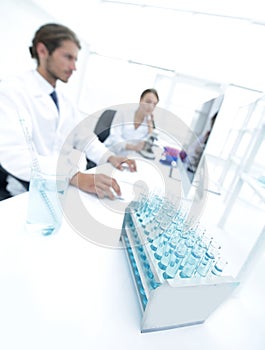 Side view of scientists working in laboratory