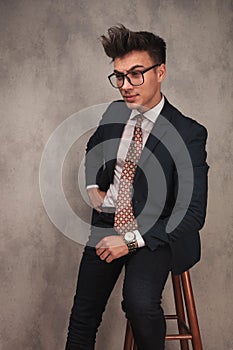 Side view of a seated young business man