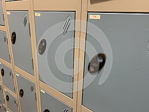 Side view of several blue and silver lockers