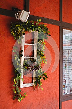 Side view of a shop display with red walls shaped as a lovely red colonial house in Vila GermÃ¢nica, Blumenau - Brazil during the