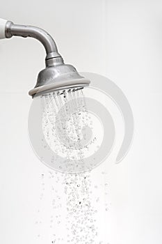 Side view of a shower head with running water